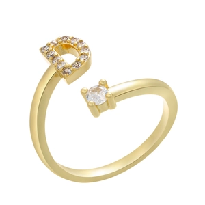Macro shot of gold-plated adjustable ring featuring letter D with micro-paved cubic zirconia