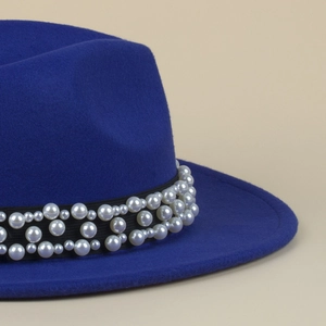 Close-up of royal blue wool fedora featuring black grosgrain ribbon with pearl embellishments