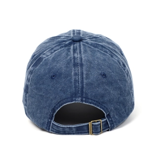 Detail of adjustable metal buckle and washed denim texture on a retro baseball cap