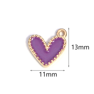 Purple heart enamel charm with gold trim measuring thirteen millimeters in height