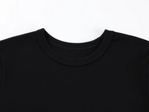Detail of the double-stitched crew neck and fine knit texture of this black modal slim t-shirt