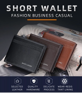 Three-color short leather wallets stacked on a magazine featuring embossed geometric detail