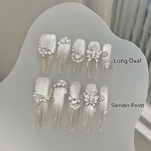Luxury cat-eye press-on nails set with rhinestone butterflies and pearl accents