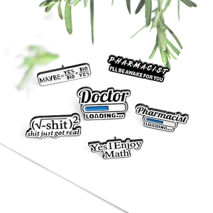 Detail of creative geek enamel pins featuring math formulas and profession slogans