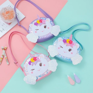 Detailed view of three unicorn sequin crossbody bags in purple, pink and blue colors