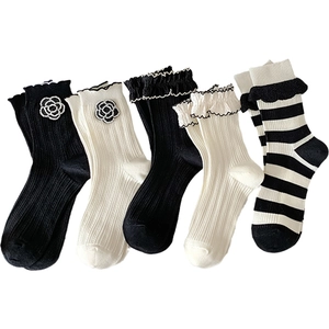 Lolita style mid-calf socks with camellia flowers and lace trim in black and white
