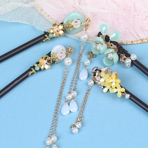 Set of four vintage wooden hairpins with golden metal flowers, pearls and green tassels