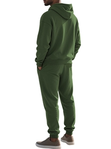 Detail view of forest green waffle texture on men's oversized athletic hoodie set