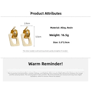 Detail view of geometric resin drop earrings with gold alloy hoops and size specifications