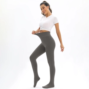Detailed close-up showing high-waisted elastic fit and dark gray thermal leggings texture