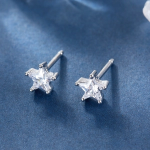 Macro shot of S925 sterling silver star stud earrings with clear zircon stones