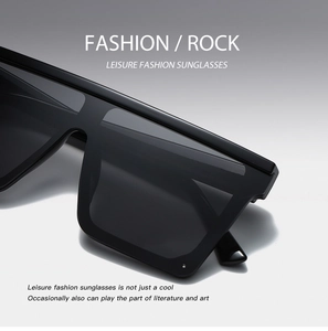 Primo piano di occhiali da sole neri oversize con finitura lucida in stile fashion rock