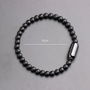Mens beaded bracelet with matte black beads and a magnetic clasp, 6cm inner diameter