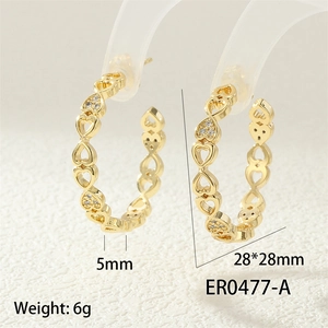 Detail view of gold heart hoop earrings measuring 28x28mm with micro-set cubic zirconia