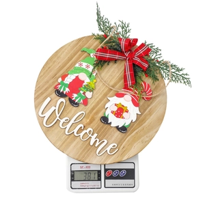 Detailed close-up of a Christmas gnome welcome sign showing 381g weight on a scale