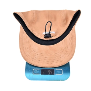 Minimalist solid color suede-like baseball cap weighing 94 grams on scale