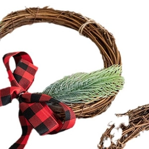 Handmade Christmas rattan wreath with red and black buffalo plaid bow and green pine needles