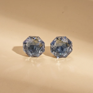 Minimalist grey-blue hexagonal cut crystal stud earrings with polished silver pin facets