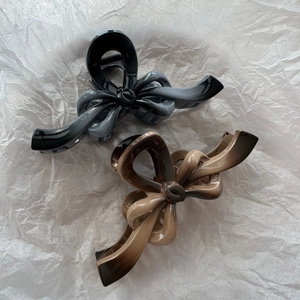 Large bow hair claw clips in gradient black-grey and brown-beige with glossy finish