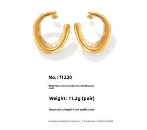 Detail view of gold U-shaped earrings with 4.1x3.5cm dimensions and titanium steel specs