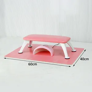 Detailed view of pink leather nail arm rest with UV lamp and 60x40cm waterproof desk mat