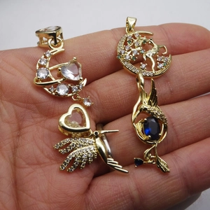 Gold hummingbird moon pendant and tree life charm necklace with vibrant zircon gemstones
