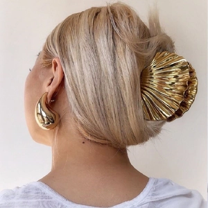 Polished gold shell hair claw and matching teardrop earrings set for women