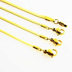 Detail of four gold vacuum-plated stainless steel snake bone bracelets with lobster clasps