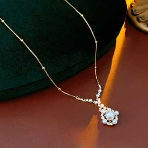 French vintage gold plated necklace featuring elegant pearls and sparkling zircon stones
