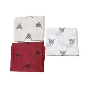 Close-up of Highland cow printed scarf set in beige, white, and dark red soft fabric