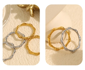 Detailed comparison of bamboo joint rings in gold and silver finish on textured background