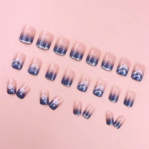 Short round pink and blue gradient press-on nails with silver glitter and cherry blossoms