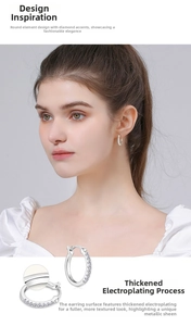 Macro detail of S925 sterling silver hoop earrings featuring thick plating and secure clasp