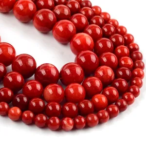 Macro detail of red natural stone round beads with high gloss and smooth texture
