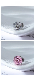 Detailed view of four-claw nest cut cubic zirconia stud earrings in white and pink stone