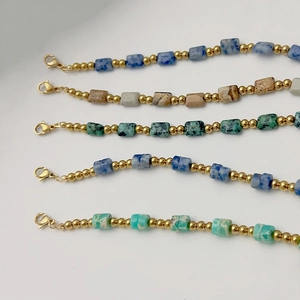Bohemian style gold beaded necklaces set with colorful rectangular natural stones and clasp