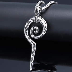 Detailed macro view of vintage silver snake scepter pendant with Norse viking runes