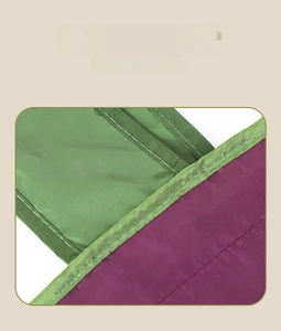 Reinforced double stitching detail on green and purple foldable oxford shopping bag