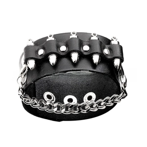 Macro view of black leather punk bracelet with silver cone spikes and chain details