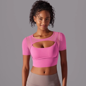 Close-up of bright pink double-layer sports top with mesh sleeves and U-shaped cutout