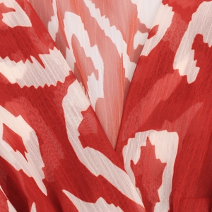 Robe sans manches en mousseline avec imprimé géométrique rouge et blanc et jupe à volants