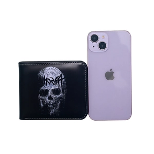 Men's bifold skull wallet in black, shown next to a smartphone for size reference