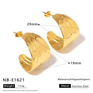 Detailed view of gold stainless steel C-shape earrings with irregular hammered texture