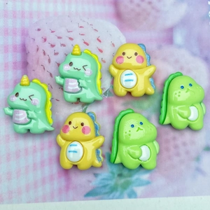 Macro view of colorful resin cartoon dinosaur charms for DIY hair clips and crafts