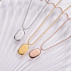 Macro detail of oval titanium steel necklaces in gold, silver and rose gold finishes