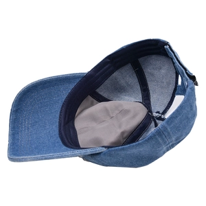 Distressed blue denim ponytail baseball cap featuring inner sweatband and adjustable back