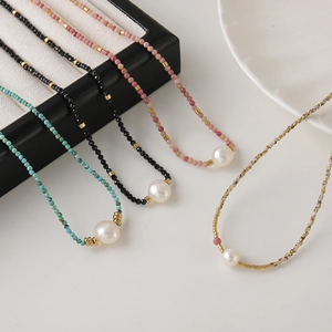 Minimalist beaded necklace with natural stones and white pearl accents for women