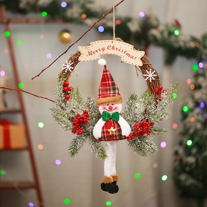 Christmas snowman grapevine wreath with pine needles, berries and Merry Christmas banner