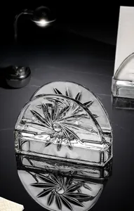 Detailed view of thick crystal glass tissue holder with vertical sunburst ribbed pattern
