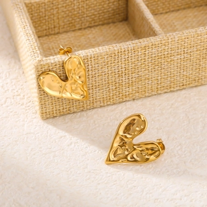 18K gold plated heart stud earrings with irregular hammered texture on jewelry box